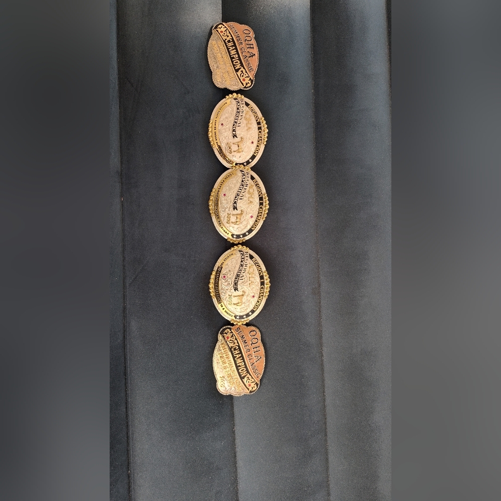 Bundle of AQHA championship buckles